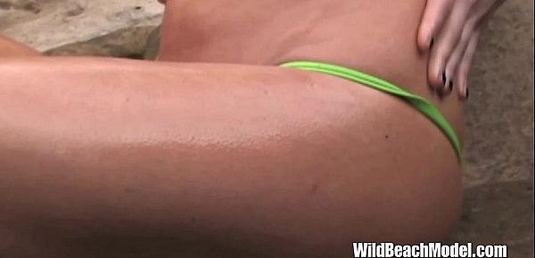  Bikini Beach Babe Oils Her Tanned Skin